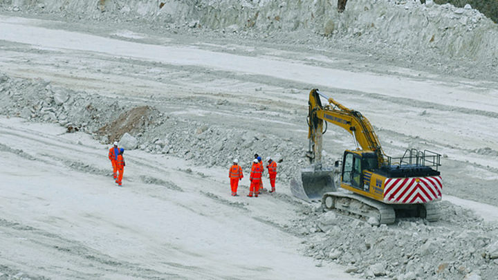 Excavator Cat in quarry on HSE inspection in America