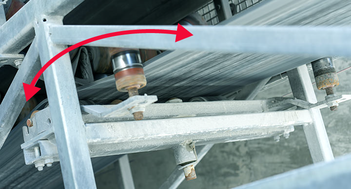 Belt tracker mounted under conveyor belt